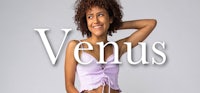 a woman in a purple top with the word venus on it